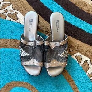White Mountain Metallic and Black Wedge Mules